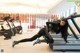 A woman on a treadmill in a gym.